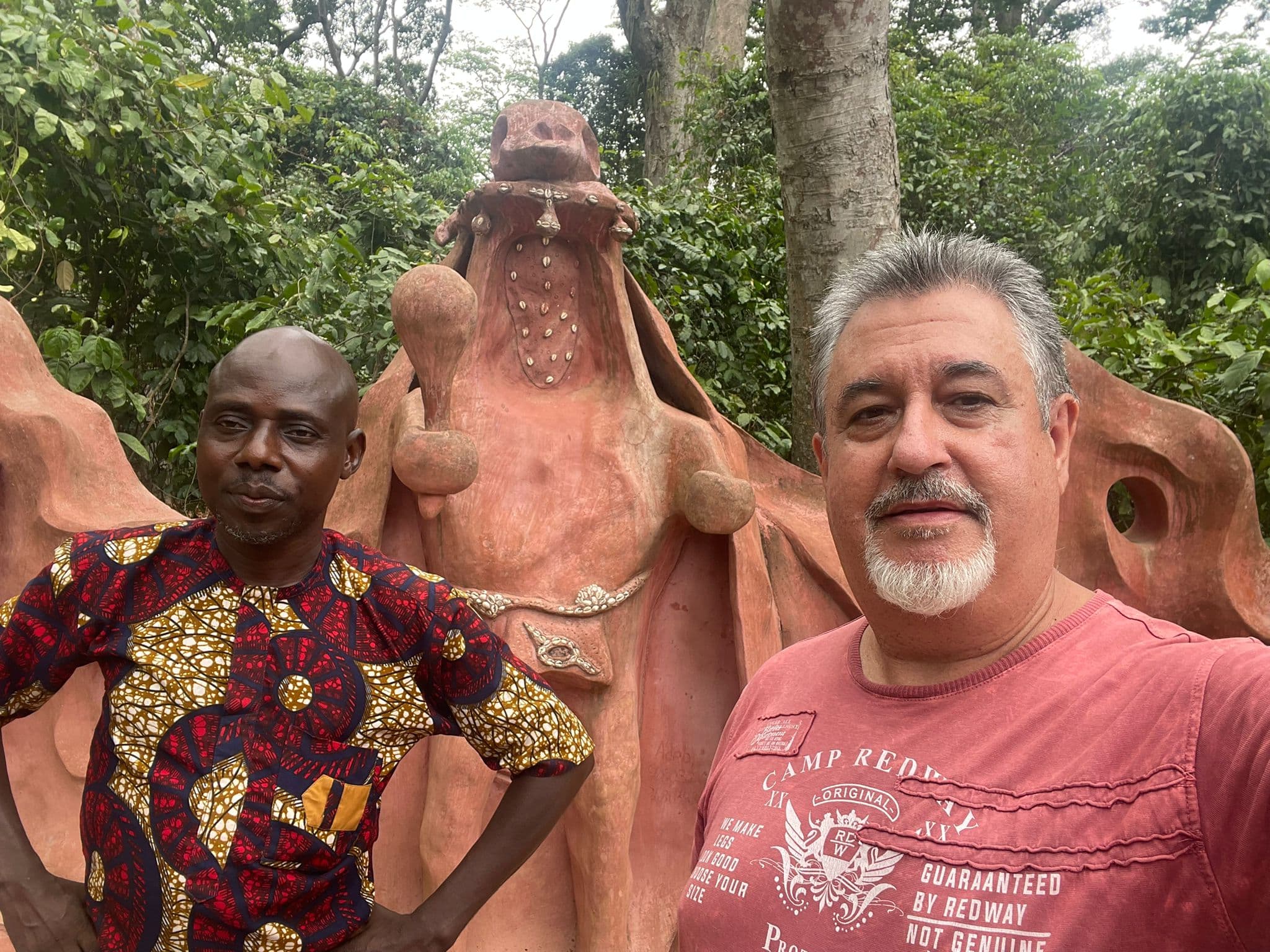 A Ucomeafrik guide and traveler at a cultural site in Nigeria